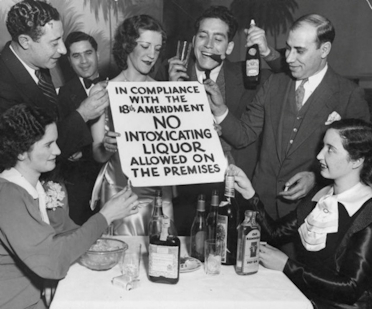 Americans in a speakeasy taking the prohibition seriously